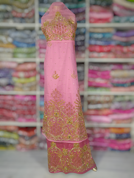 Gold Design on Bright Pink Background Handwork George