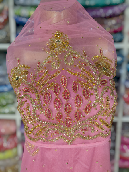 Gold Design on Bright Pink Background Handwork George