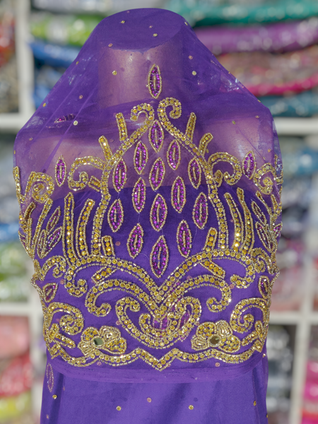 Gold Design on Purple Background Handwork George